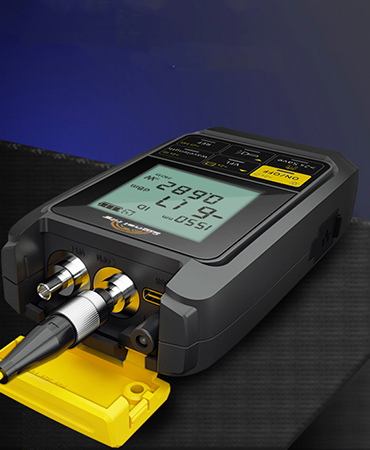 Technician measuring fiber signal power